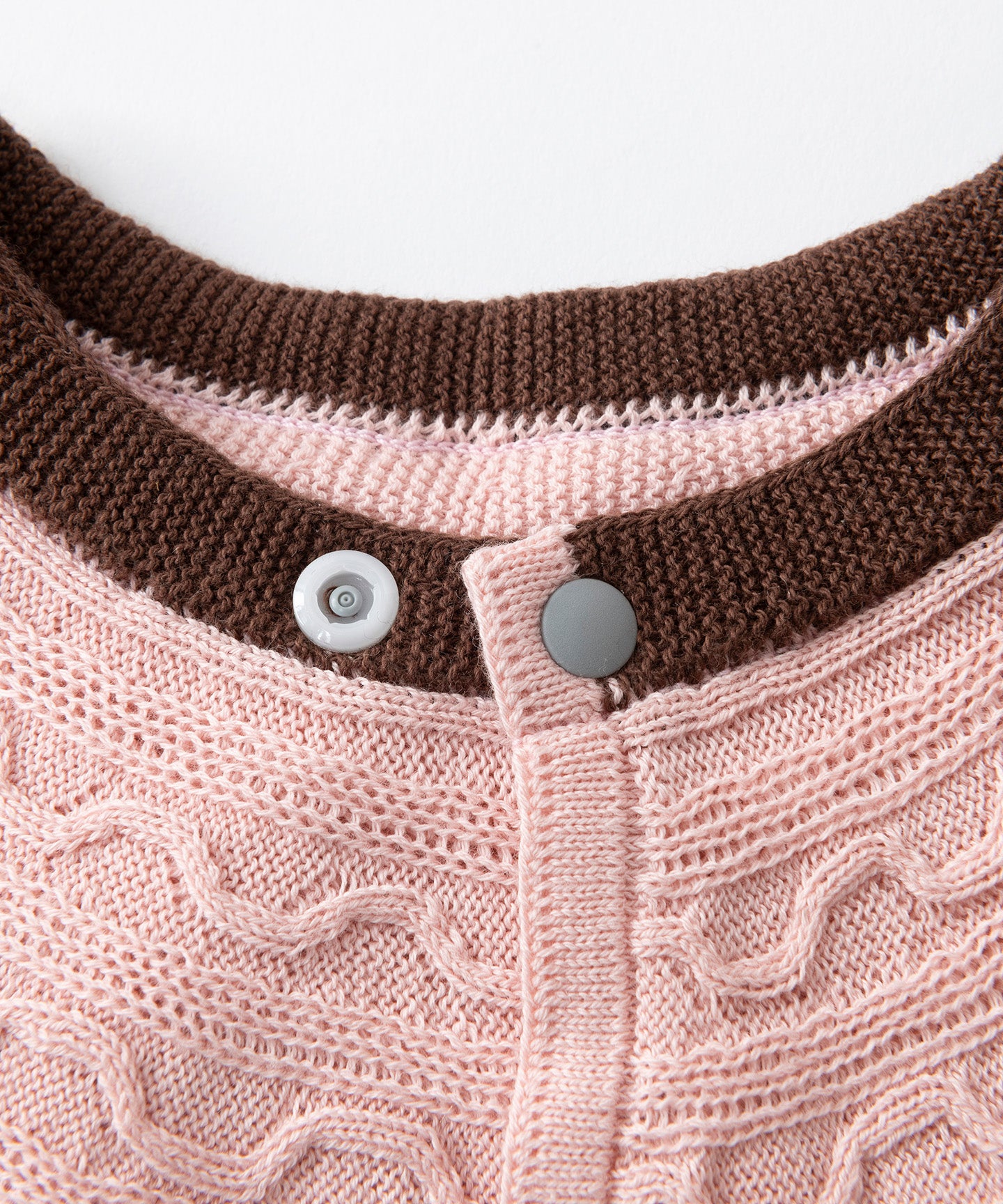 CABLE PATTERN KNIT BIB